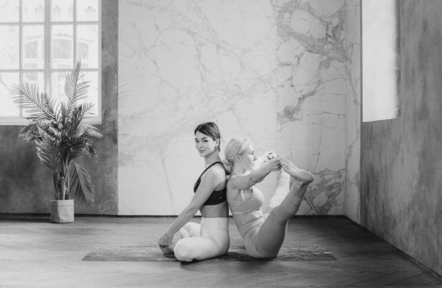 Instructor Amara Osei demonstrating a floor-based relaxation posture
