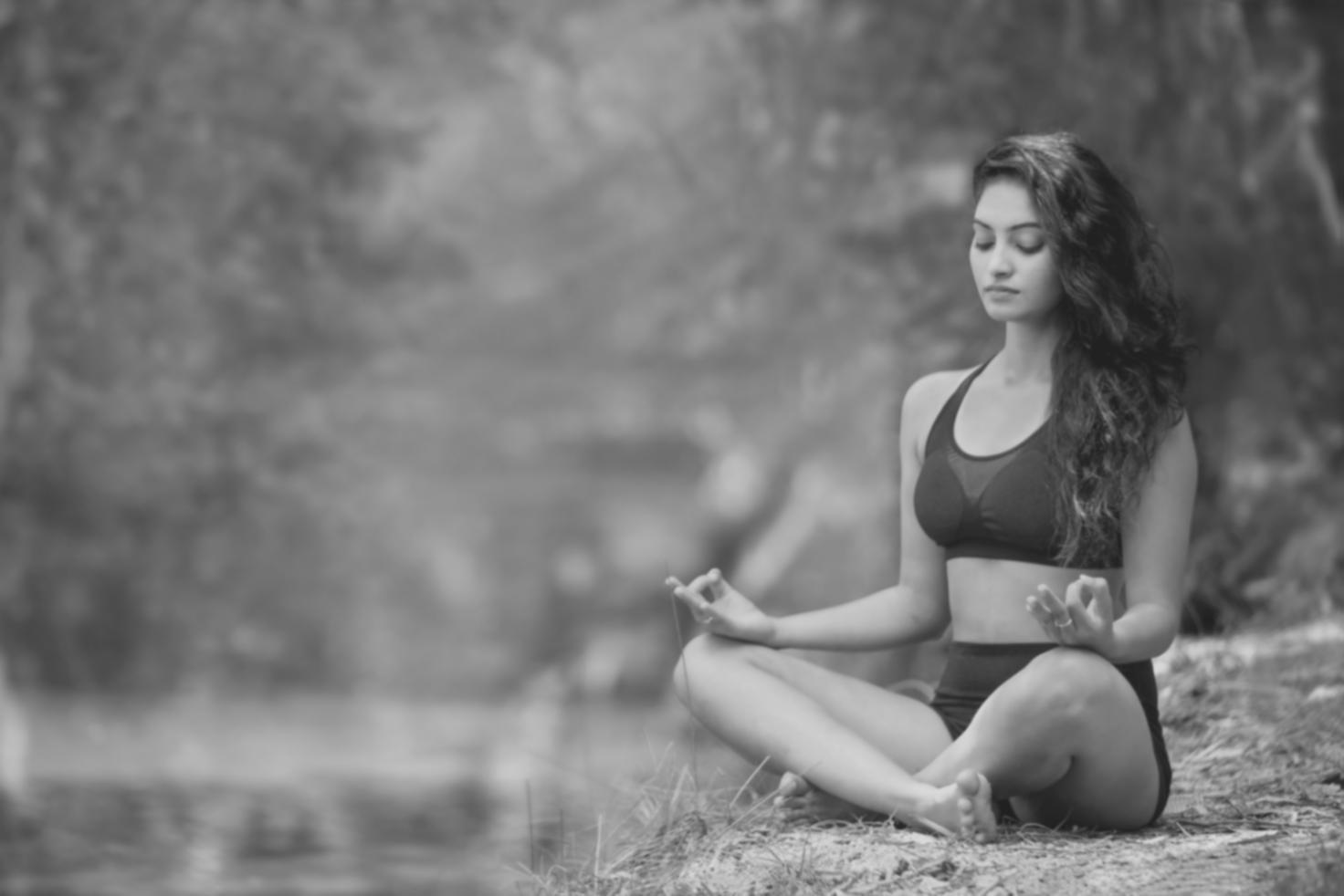 Yoga instructor demonstrating a calming stress-relief pose during a Cedilo Maruth masterclass session